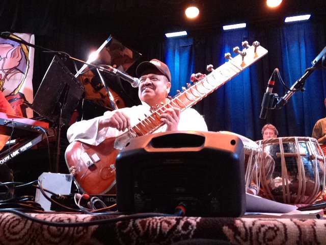 Ashwin Batish tuning his Sitar - live at the Kuumbwa Jazz Center, Santa Cruz. All rights reserved. 2012 Ashwin Batish. Copyrighted image. Photographer Chris Bratt